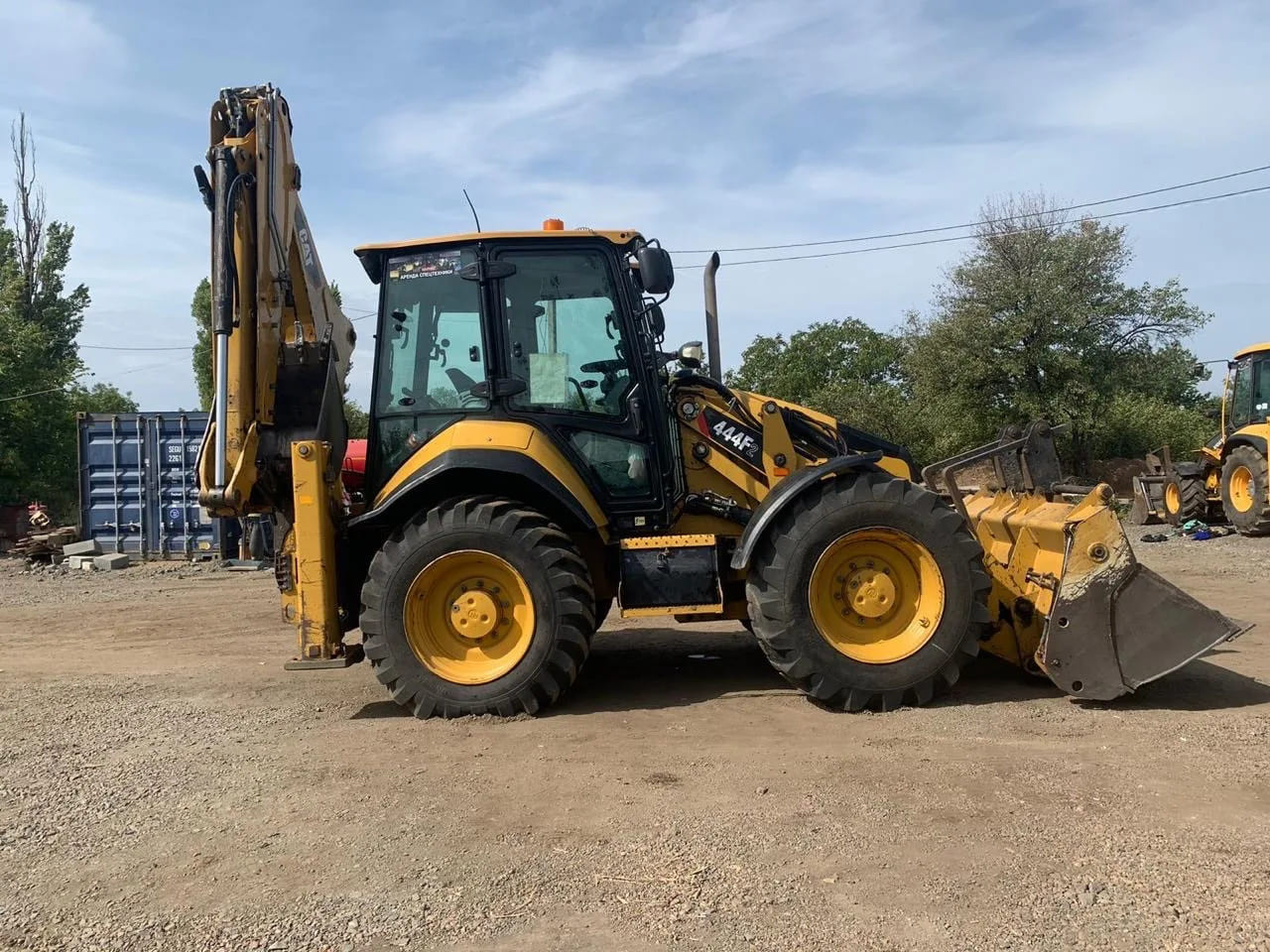 Экскаватор-погрузчик Caterpillar 444F2